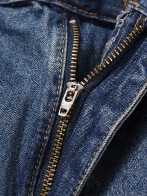 Carpenter denim bermuda shorts in medium wash with a metal zipper fly and contrast stitching.