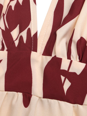 Maxi dress with deep V-neck and bold floral print in cream and burgundy.