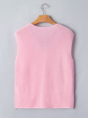 Pink acrylic V neck sweater vest with button front detail.