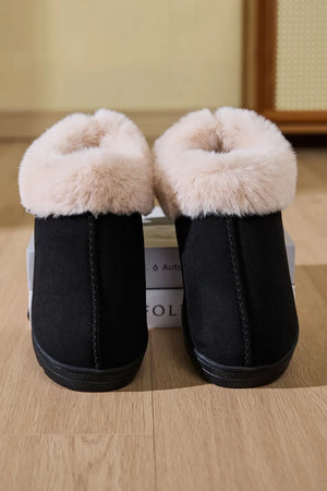 Black suede slippers with plush shearling trim detail