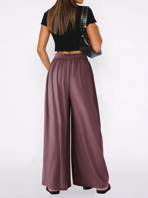 Drape-front wide-leg jersey trousers in Moonlit Mauve with a smocked waistband.
