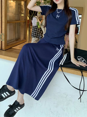 Dark blue striped tee and midi skirt ensemble with white side stripes and bow detail.