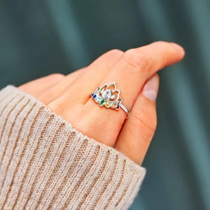 Sterling silver ring with lotus design and colorful gemstones.