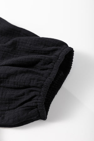 Black gauze blouse with cinched puff sleeve detail