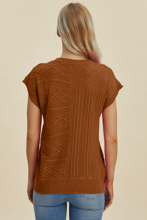 Brown knit patchwork top with cable and diamond textures, short sleeves.