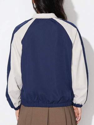 Colorblock raglan sleeve bomber jacket in dark blue with light beige accents.