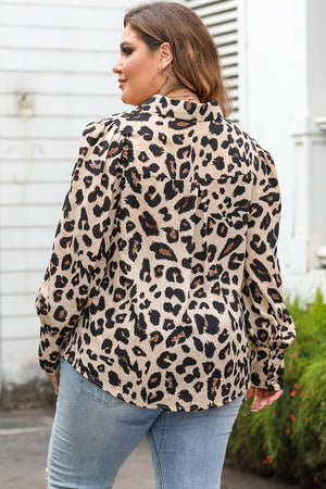 Leopard print blouse with blouson sleeves and a collared neckline.