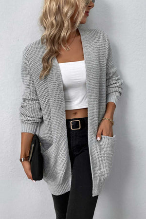 Light gray waffle knit longline cardigan with pockets and ribbed cuffs.