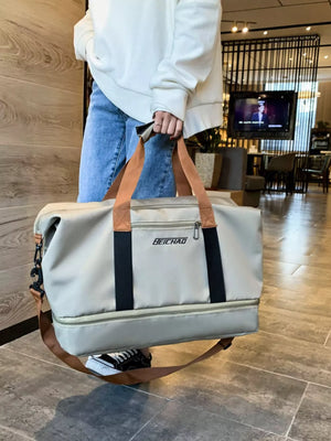 Light grey Oxford cloth travel bag with dual handles and a detachable strap.