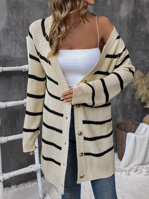 Beige acrylic knit cardigan with wide black stripes and button front.