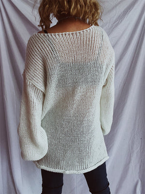 White open-knit slouchy boatneck pullover sweater with wide sleeves.