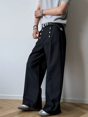 Black high-waisted wide leg pants with button detail and a relaxed fit.