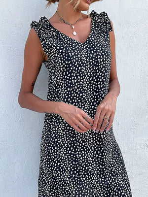 Black leopard print mini dress with ruffled cap sleeves and V-neck.