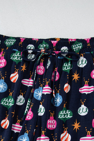 Navy blue lounge pants with festive bauble print and drawstring waist.