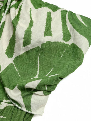 Tropical print strapless maternity jumpsuit with tie-front detail in green and white.