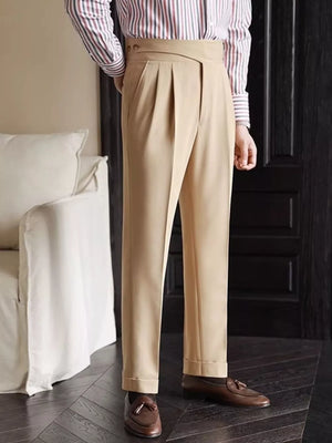 Khaki pleated wide-leg dress pants with cuffed hems and a crossover waistband detail.