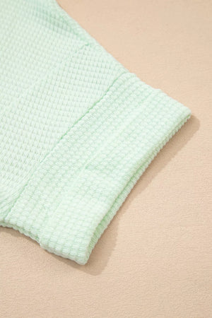 Light green waffle knit maternity t-shirt sleeve detail