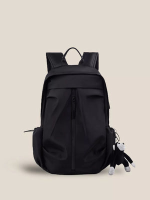 Black nylon drawstring backpack with zip pockets and monkey charm