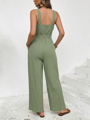 Green crinkled texture tie waist wide leg maternity jumpsuit with square neckline and wide straps.