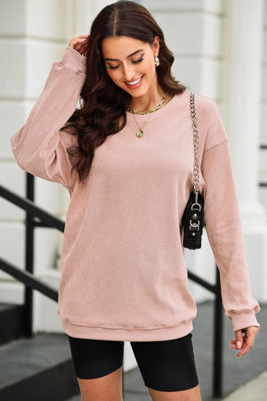 Textured ribbed crewneck pullover in Dusty Pink with long sleeves and a relaxed fit.