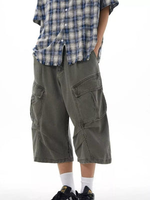 Relaxed fit grey cargo capris with multiple pockets and a wide leg.