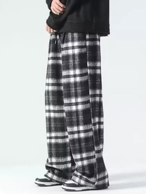 Black and white plaid wide-leg sweatpants with drawstring waist.