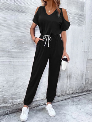 Black cold-shoulder jumpsuit with drawstring waist and cuffed ankles