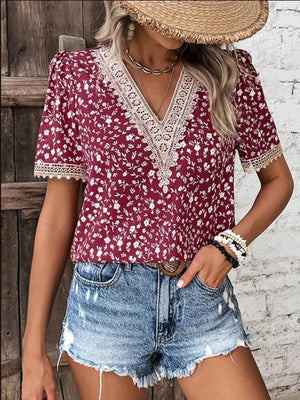 Floral lace trim v-neck blouse in a deep red with white floral print.