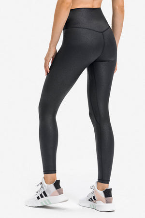 Black textured high-waisted leggings with a V-seam detail at the back.