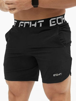 Black performance training shorts with branded waistband and logo detail