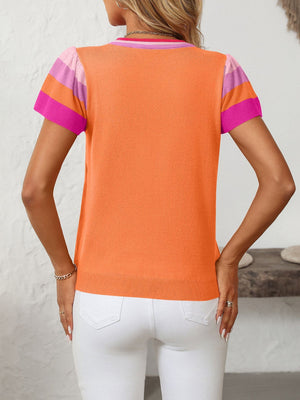 Colorblock knit top in tangerine with pink and sky blue striped flutter sleeves and neckline.