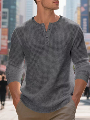 Men's dark gray waffle knit henley t-shirt with button placket.