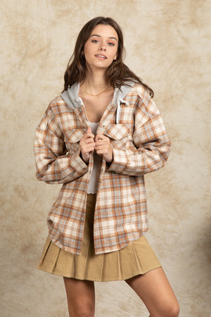 Cozy plaid shacket in Camel with sherpa hood and button front detail.