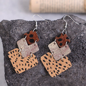 Textured leopard print drop earrings in tan and dark brown with layered squares.