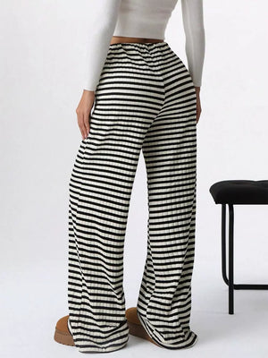 Striped ribbed wide-leg pants with drawstring in black and white.