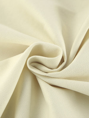 Chic cotton midi skirt in beige with a visible slit detail and subtle ribbed texture.