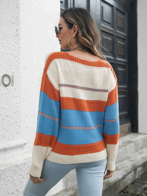 Colorblock knit V-neck pullover sweater in Azure with orange and cream stripes.