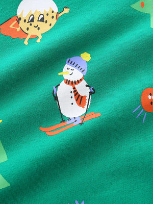 Green cotton sweatshirt with festive print of a skiing snowman and a superhero cookie.