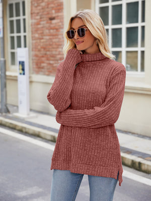 Ribbed turtleneck sweater in Brick Red with side slits, long sleeves, and a relaxed fit.