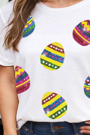 White crewneck tee with colorful sequin Easter egg appliques.