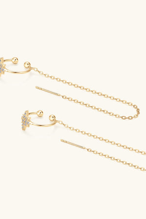 Gold threader earrings with moissanite starbursts and long chain details.