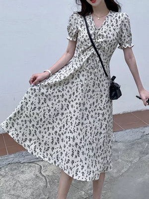 White botanical print midi dress with puff sleeves and drawstring waist