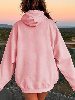 Oversized blush pink hoodie with pouch pocket, relaxed fit, long sleeves.