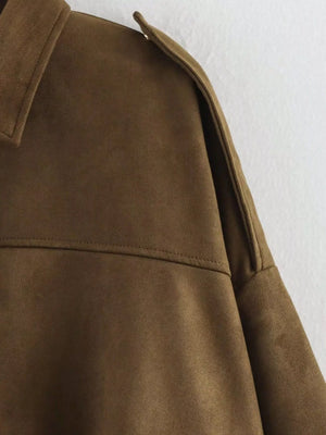 Brown oversized zip-up jacket with shoulder detail and collar.