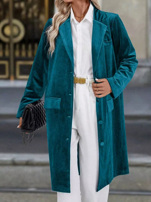 Deep Teal velvet longline trench coat with lapel collar and buttoned front.