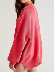 Oversized ribbed knit sweater in strawberry with drop shoulders and cuffed sleeves.
