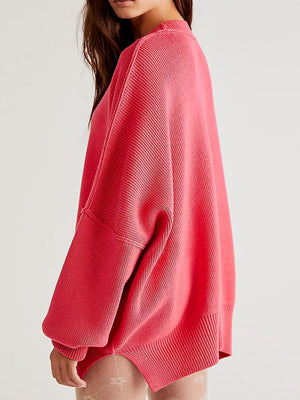 Oversized ribbed knit sweater in strawberry with drop shoulders and cuffed sleeves.