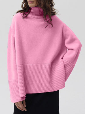 Pink ribbed turtleneck sweater with flared sleeves and ribbed hem detail