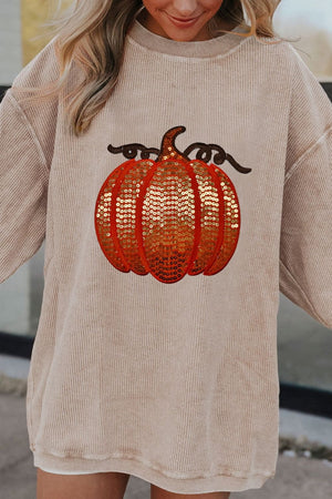 Eggshell corduroy sweatshirt with sequin pumpkin graphic and brown vine detail.
