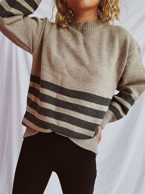 Horizontal stripe ribbed knit sweater in mocha, dark gray, or tan acrylic.